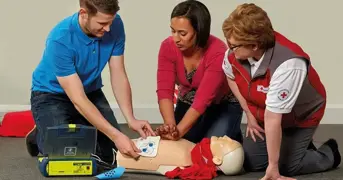 First Aider Learning How To Use Aed Pads On A Course Listing Page