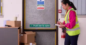 Fire Marshal Checking Safety In The Workplace